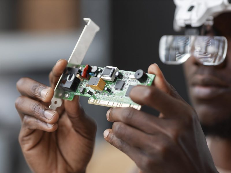 close-up-man-repairing-computer-chips-min